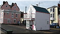 A house in a carpark