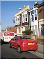 Sports car outside The Golden Eagle in Delamere Road