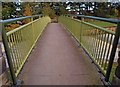 Crossing the footbridge over the spillway