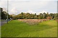 Grassy island enclosed by A27 Chilworth Road