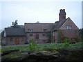 Big cottage beside a narrow lane