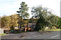 Entrance to former surplus store, and houses in Station Yard, Alderholt, Dorset