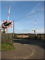 TG2925 : View north across railway crossing by Evelyn Simak