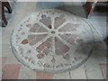 TG1537 : Wheel motif in floor of St Peter's Church, North Barningham by Humphrey Bolton