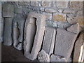 NY9166 : Grave slabs in the porch of St. Michael's Church, Warden by Mike Quinn