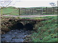 Auchengassel Burn draining under track