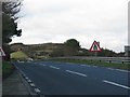 The A35 dips towards the roundabout before Lyme Regis