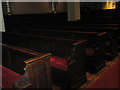Ancient pews within  St George