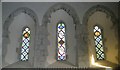 SU8014 : Stained glass windows above the altar at St Peter, East Marden by Basher Eyre