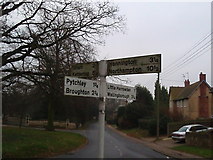 SP8672 : Road sign in the middle of Orlingbury by James Haynes