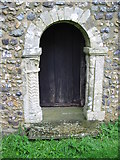 TR1939 : Door in the S wall of St Oswald's church by Nick Smith