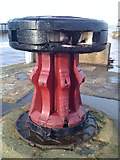 NZ9011 : Capstan on Whitby East Pier by Neil Reed
