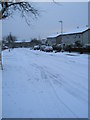 Looking south-eastwards down a snowy Elkstone Road