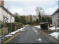 Looking up Old Court Road towards the junction with Alresford Road