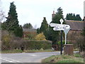 Holt: Horseshoes signpost