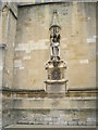 Statue of Bishop Waynflete on the wall of Eton College Chapel