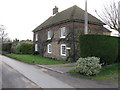 House on the W side of Knell Lane