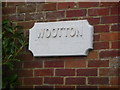 SZ2498 : Wootton: old post office sign by Chris Downer