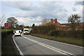 Ambulance on the A530 in Minshull Vernon