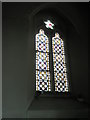 Stained glass window in the chancel at St John the Evangelist, West Meon