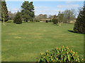 Landscaped garden around Woodmancote Place