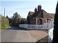 Norton Road with the lodge by the entrance to Norton Court