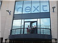 Trio of trumpeters on thebalcony of Next