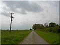SK9209 : Power lines crossing lane near Grange Farm by Steve  Fareham