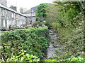 River running alongside River Terrace, Trefor