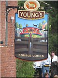 SX9390 : Double Locks pub sign by Sarah Charlesworth