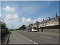 A small housing estate alongside the A5025 at Llanynghenedl