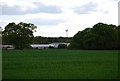 Communications mast across a field of Wheat