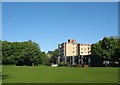 Multi-storey flats and playing field at Menai Bridge