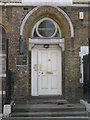 Doorway of  the (former) St. George The Martyr Parochial Schools, Old Gloucester Street, WC1