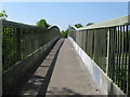 View west across footbridge that links America Wood with Ashington