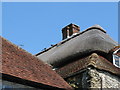 Straw pheasants on thatched roof in Amberley village