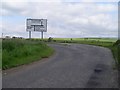 Road sign at junction on Robroyston Road