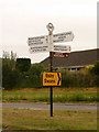 Winterbourne Steepleton: finger-post and swans sign