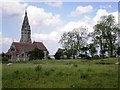 A  pastoral view of East Heslerton church