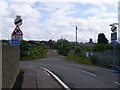 Sharp bend on road near Newton Village