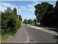 Looking east along the A272 towards the roundabout at the offset junction with the A275