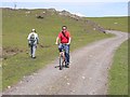 L6988 : Cyclist and walker on Clare Island by Oliver Dixon