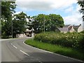 Sharp bend leading to the railway bridge at Llangwyllog