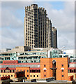 Barbican towers seen across the rooftops from City Road, London