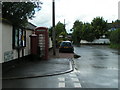 Village notice board, post box and telephone