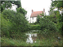 TG2900 : House and pond by the junction of Church Meadow Lane and Green Lane by Evelyn Simak