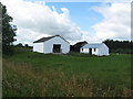 NZ0924 : Animal shelter and storage sheds by peter robinson