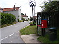 TM3463 : Glemham Road, Sweffling Village Sign, Telephone Box & Main Street Postbox by Geographer