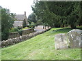 Bend in the road as seen from the churchyard at Steeple Aston