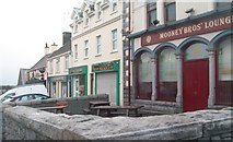J3436 : Mooney Bros Lounge Bar and shops in Main Street by Eric Jones
